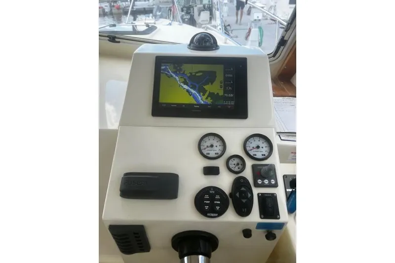 Slide: The Image of Control panel of a 2016 Eastern 27 Islander boat with navigation display and gauges. - 22