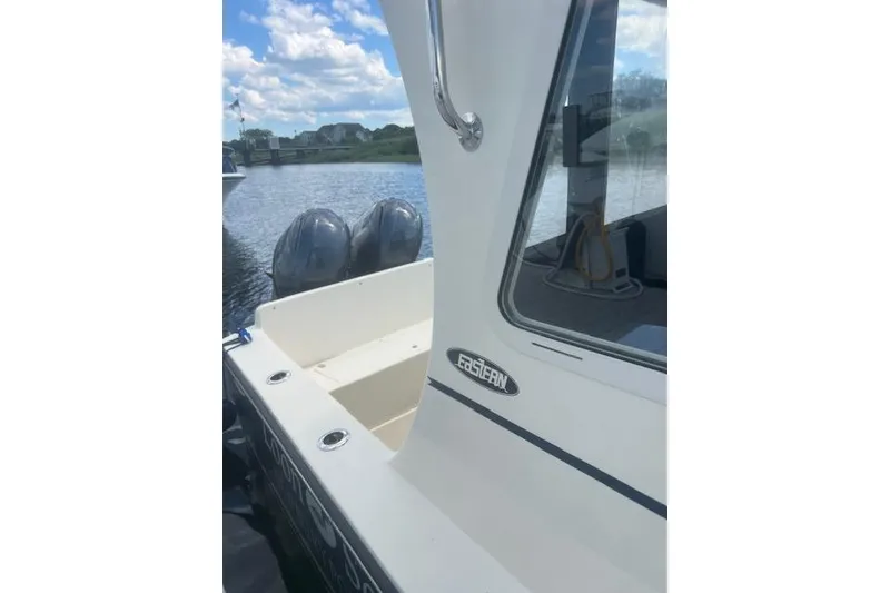 Slide: The Image of 2016 Eastern 27 Islander boat docked by a scenic waterfront. - 43