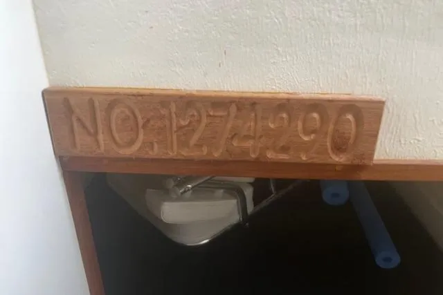 Slide: The Image of Wooden plaque with number "1274290" on Eastern 27 Islander, 2016 model. - 29
