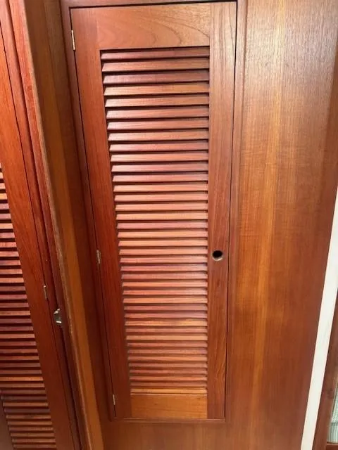 Slide: The Image of Wooden louvered door on 1987 Tartan 40CB yacht interior. - 26