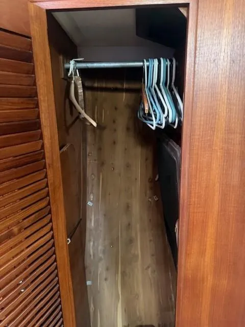 Slide: The Image of Wooden closet interior with hangers, inside a 1987 Tartan 40CB. - 27