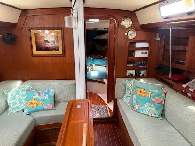 Slide: The Image of Interior of 1987 Tartan 40CB sailboat with cozy seating and nautical decor. - 28