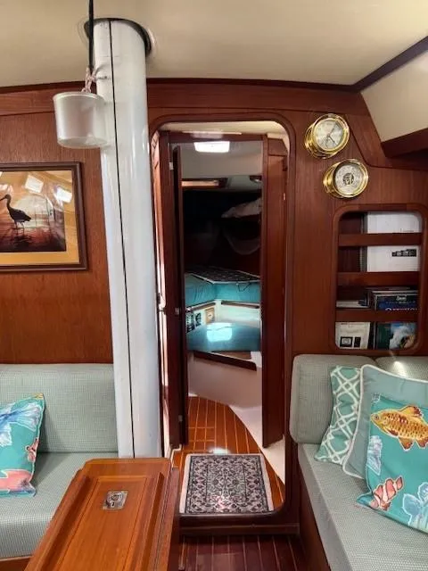 Slide: The Image of Interior of 1987 Tartan 40CB sailboat with cozy seating and nautical decor. - 32