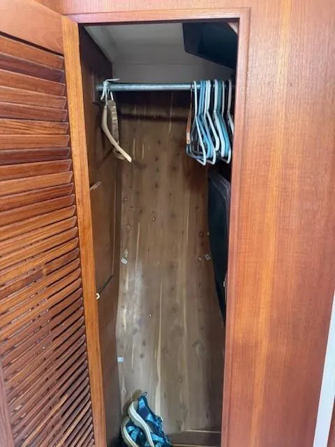 Slide: The Image of Wooden closet interior with hangers, part of a 1987 Tartan 40CB model. - 37