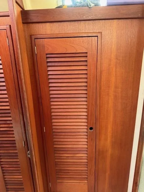 Slide: The Image of Wooden louvered door on 1987 Tartan 40CB sailboat interior. - 38