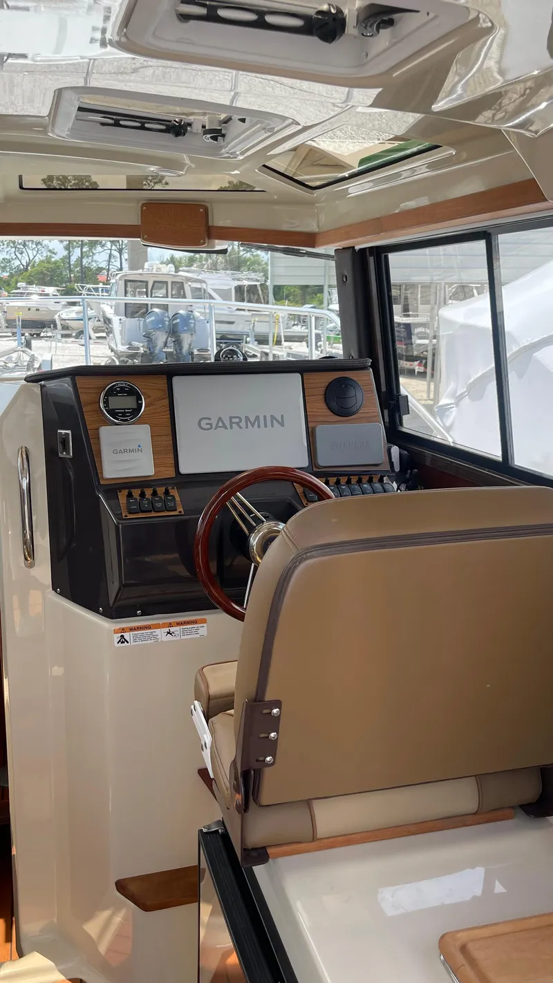 Slide: The Image of Interior of 2022 Ranger Tugs R-25 boat with Garmin navigation system. - 36