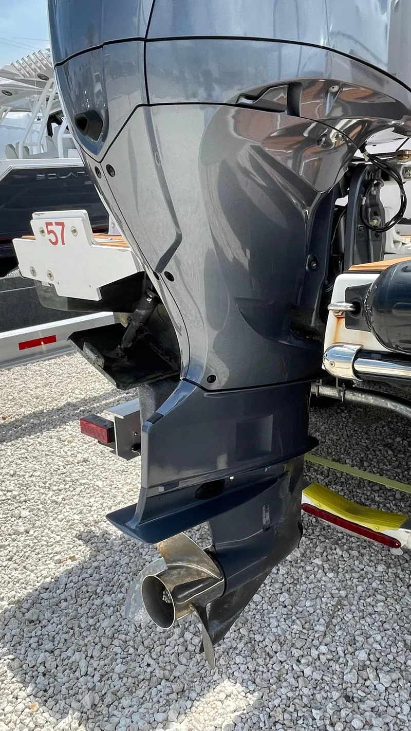 Slide: The Image of 2022 Ranger Tugs R-25 outboard motor on gravel surface. - 7