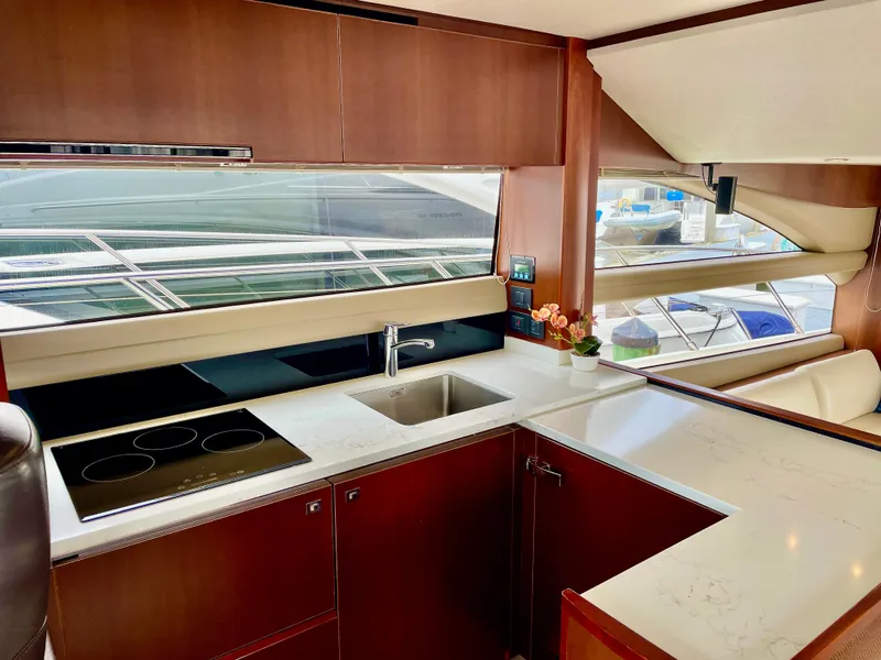 Slide: The Image of Luxurious yacht kitchen interior with modern appliances, sleek countertops, and large windows. Princess f56, 2015. - 10