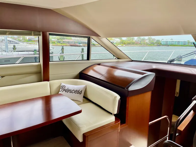 Slide: The Image of Luxurious interior of 2015 Princess f56 yacht with elegant seating and wooden finishes. - 11