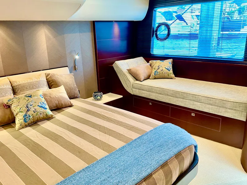 Slide: The Image of Luxurious 2015 Princess f56 yacht bedroom with striped bedding and elegant decor. - 13
