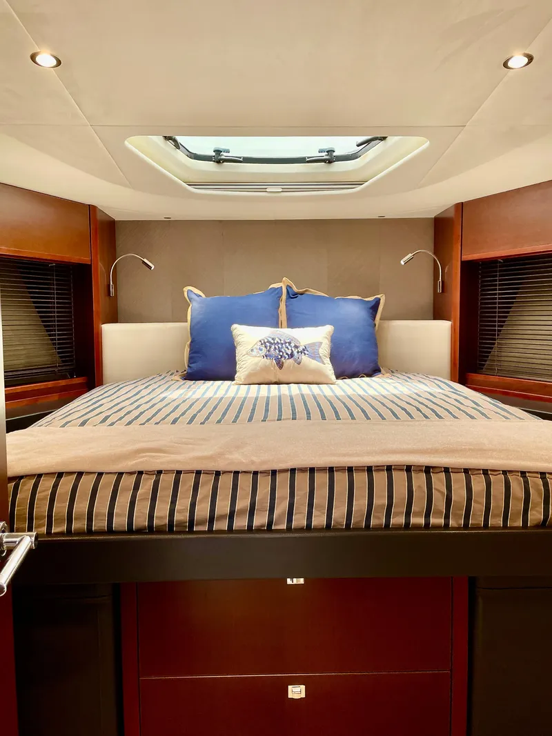 Slide: The Image of Luxurious cabin interior of 2015 Princess f56 yacht with skylight and elegant bedding. - 25