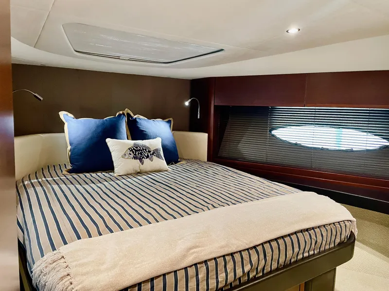 Slide: The Image of Luxurious cabin interior of 2015 Princess f56 yacht with cozy bed and elegant decor. - 27