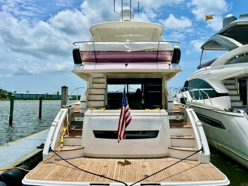 Slide: The Image of Luxury Princess f56 yacht docked, rear view with American flag, sunny day, 2015 model. - 3