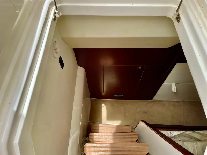 Slide: The Image of Staircase inside 2015 Princess f56 yacht, featuring wooden steps and modern interior design. - 33