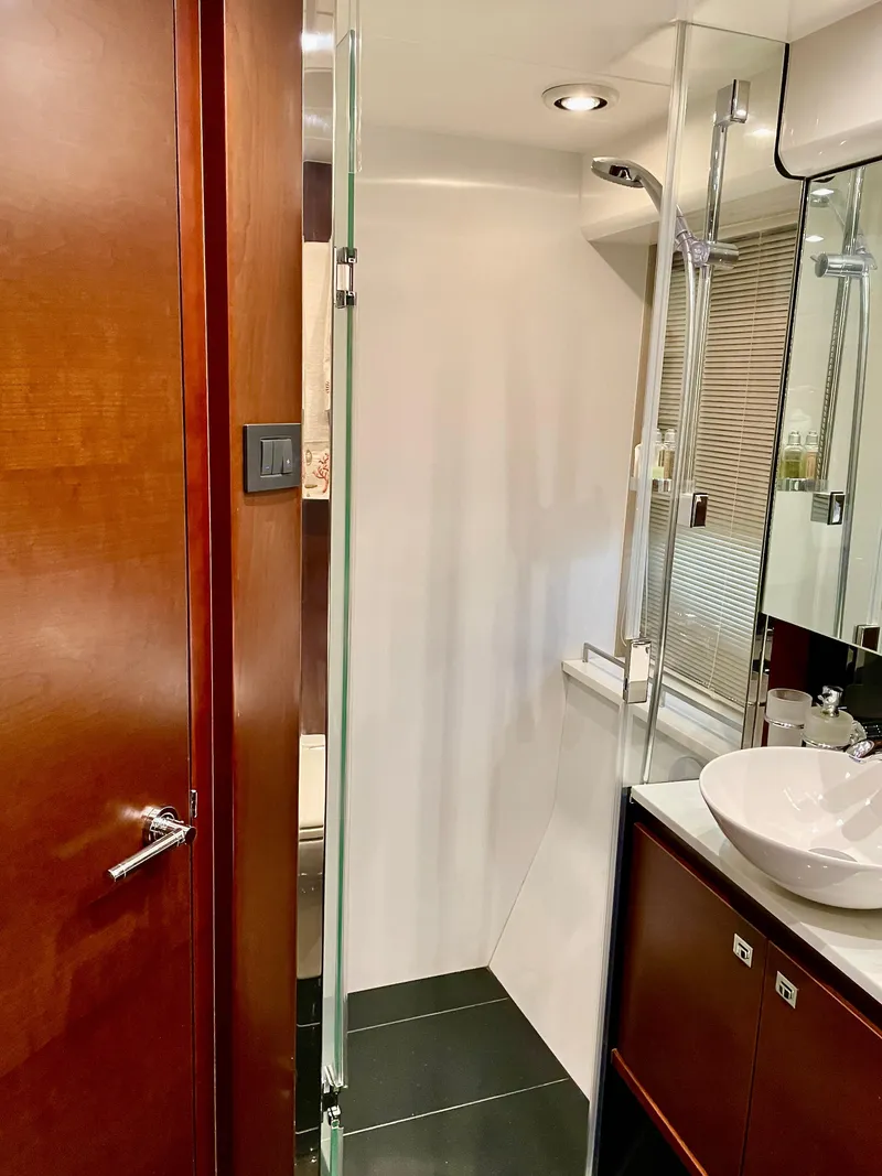 Slide: The Image of Luxurious bathroom in 2015 Princess f56 yacht with modern fixtures and wooden accents. - 35