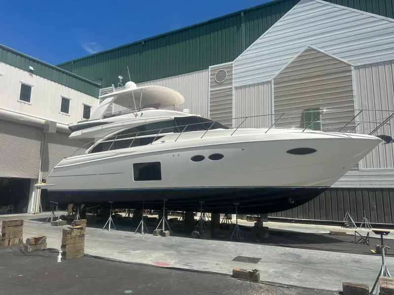 Slide: The Image of 2015 Princess F56 yacht in dry dock, surrounded by industrial buildings. - 43