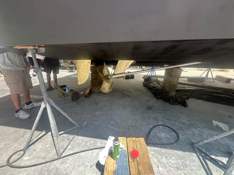 Slide: The Image of 2015 Princess f56 yacht under maintenance, showing propeller and support stands. - 45