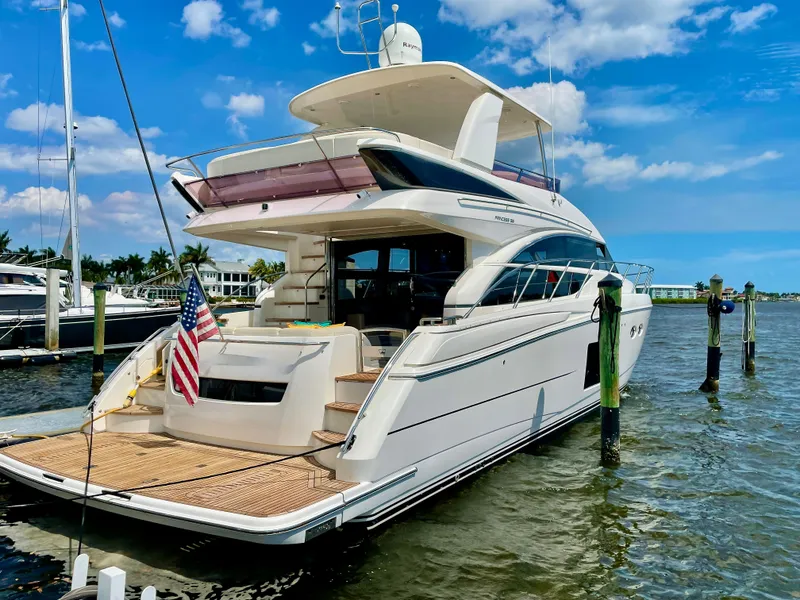 Slide: The Image of Luxury Princess f56 yacht docked, 2015 model, with American flag, under blue sky. - 5