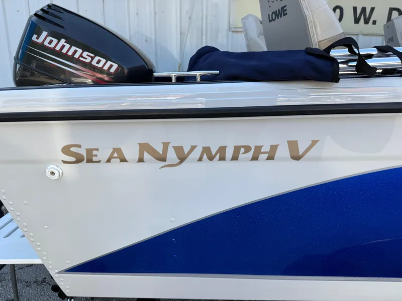 Slide: The Image of 2002 Lowe Sea Nymph V Series FM 180 boat on trailer at dealership. - 19