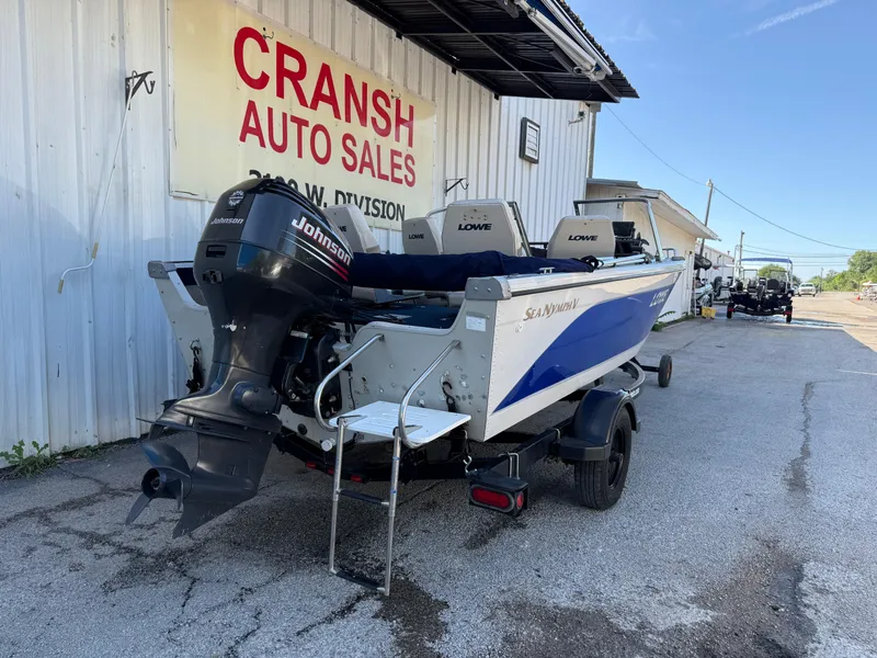 Slide: The Image of 2002 Lowe Sea Nymph V Series FM 180 boat with blue and white exterior. - 21