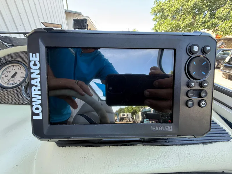 Slide: The Image of 2002 Lowe Sea Nymph V Series FM 180 boat dashboard with gauges and Lowrance fish finder. - 26