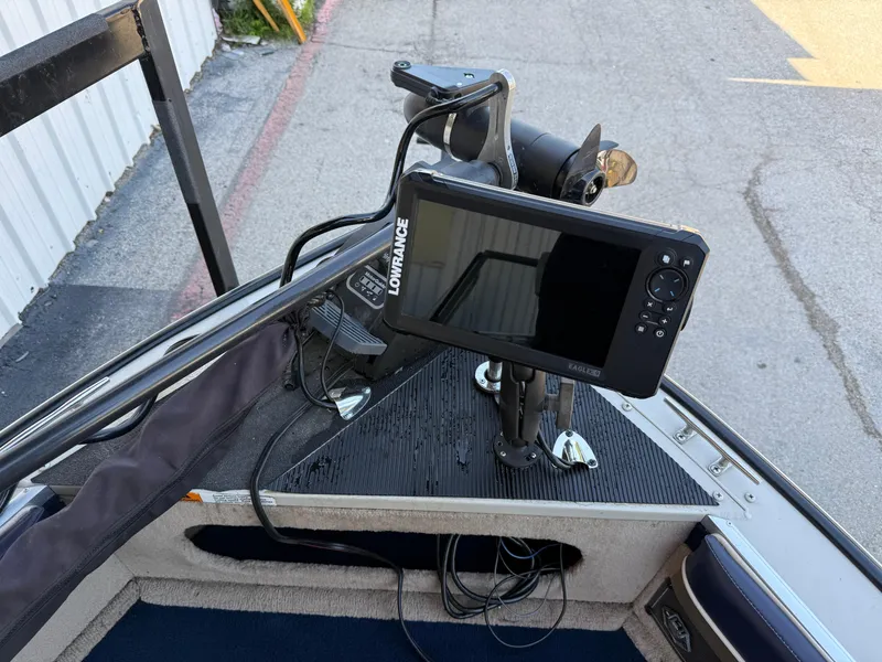 Slide: The Image of 2002 Lowe Sea Nymph V Series FM 180 boat docked near a building, sunny day. - 29