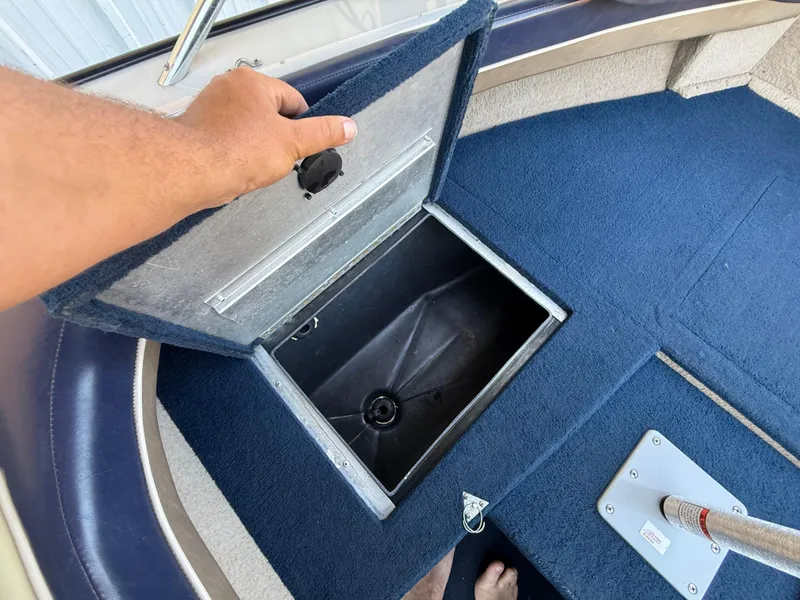 Slide: The Image of 2002 Lowe Sea Nymph V Series FM 180 boat interior with blue carpet and seating. - 37