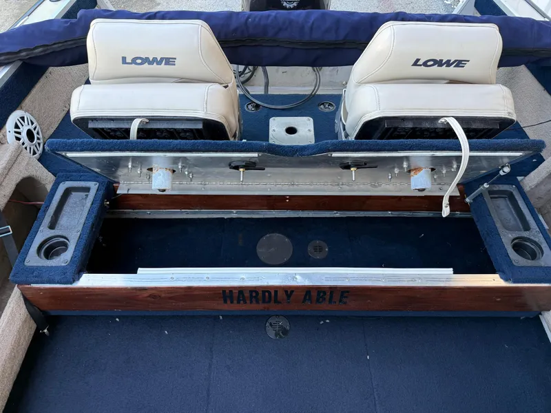 Slide: The Image of 2002 Lowe Sea Nymph V Series FM 180 boat interior with seating and steering console. - 41