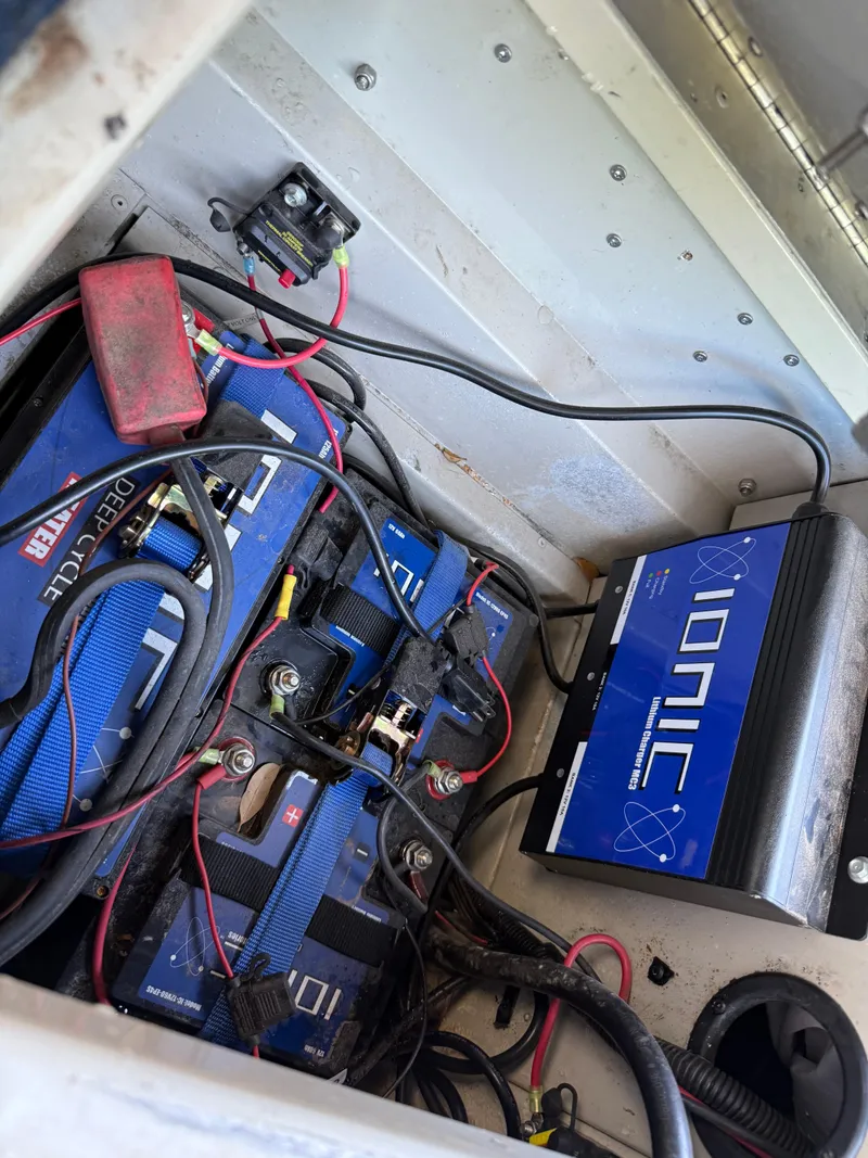 Slide: The Image of 2002 Lowe Sea Nymph V Series FM 180 boat interior with storage compartment and cup holder. - 43