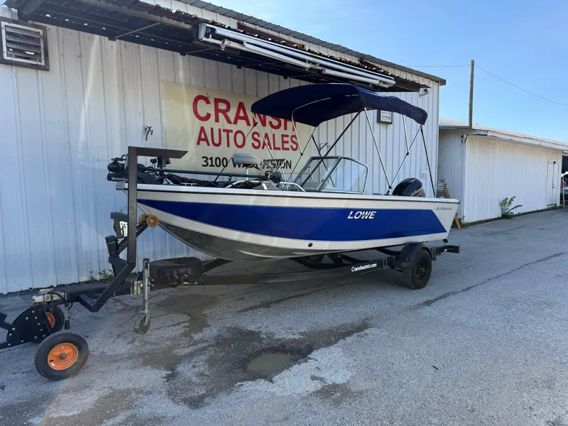 Slide: The Image of 2002 Lowe Sea Nymph V Series FM 180 boat on trailer outside Cransh Auto Sales. - 48
