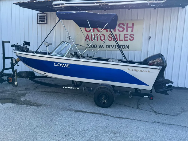 Slide: The Image of 2002 Lowe Sea Nymph V Series FM 180 boat on trailer at dealership. - 49