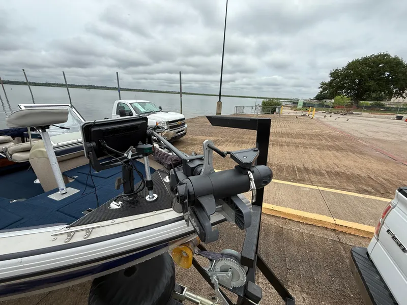 Slide: The Image of 2002 Lowe Sea Nymph V Series FM 180 boat with Johnson outboard motor at dealership. - 53