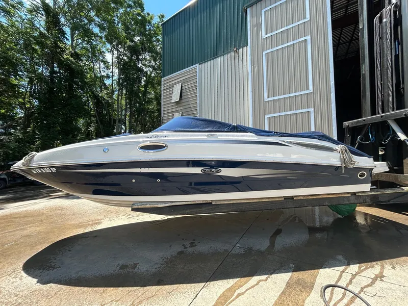 The Image of 2010 Sea Ray 260 Sundeck boat in dry dock, side view. - 1