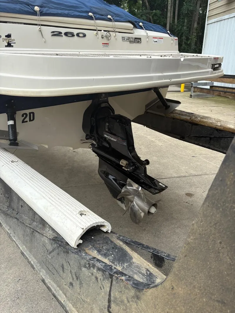 Slide: The Image of 2010 Sea Ray 260 Sundeck boat stern with propeller and outdrive visible. - 14