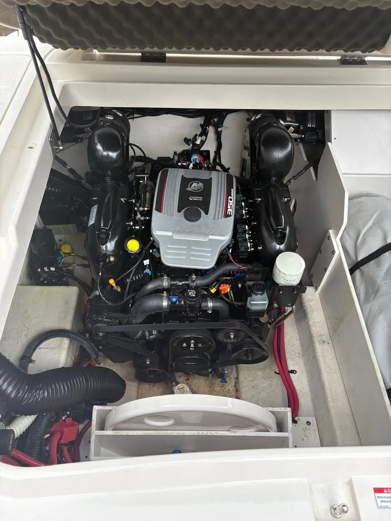 Slide: The Image of Engine compartment of a 2010 Sea Ray 260 Sundeck boat, showcasing the engine details. - 15