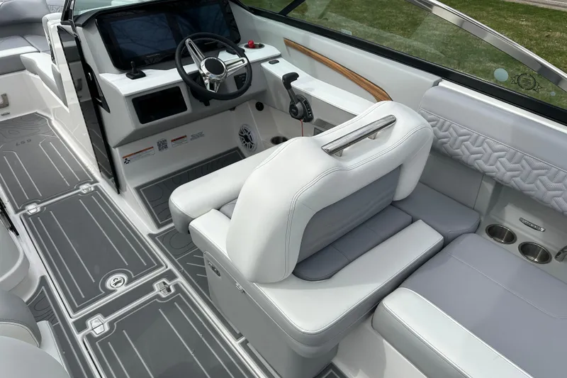 Slide: The Image of 2026 Regal LS9 boat interior with modern dashboard, steering wheel, and luxurious seating. - 10