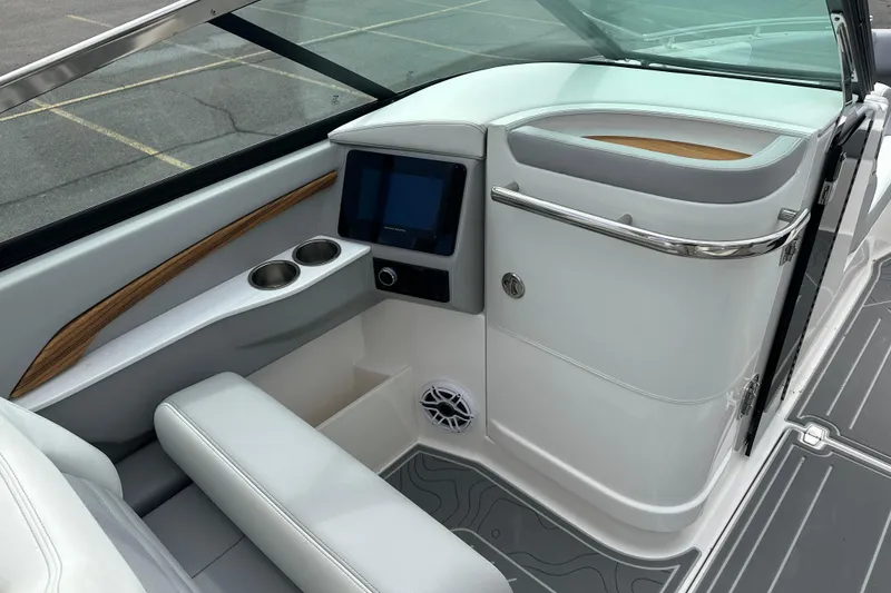 Slide: The Image of Interior of 2026 Regal LS9 boat with modern dashboard and seating. - 12
