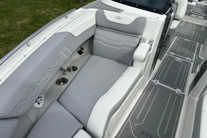 Slide: The Image of Luxurious seating on 2026 Regal LS9 boat with cup holders and stylish design. - 17