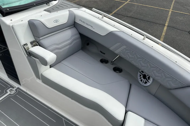 Slide: The Image of Luxurious interior of 2026 Regal LS9 boat with gray seating and cup holders. - 18