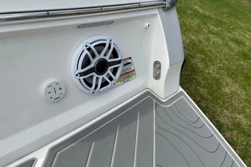 Slide: The Image of 2026 Regal LS9 boat speaker system with control panel on deck. - 23