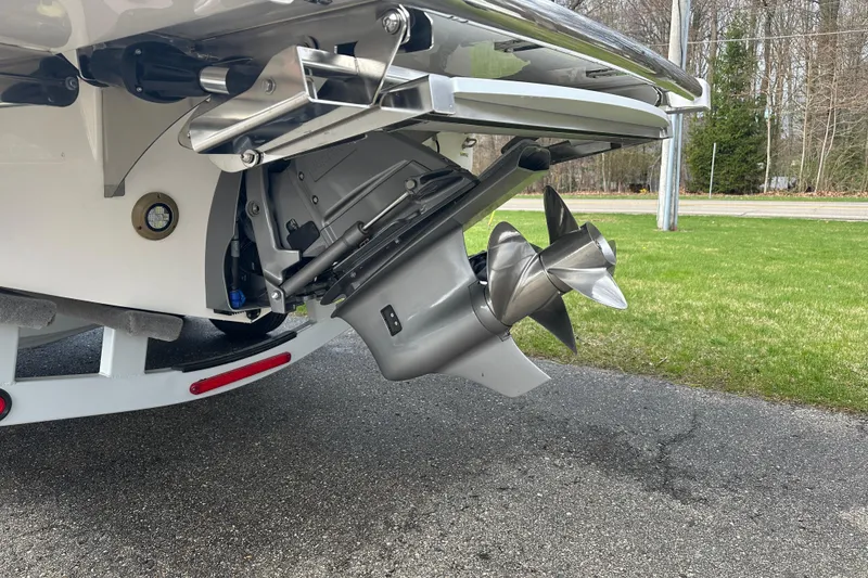 Slide: The Image of Sleek 2026 Regal LS9 boat propeller and stern drive on pavement. - 4