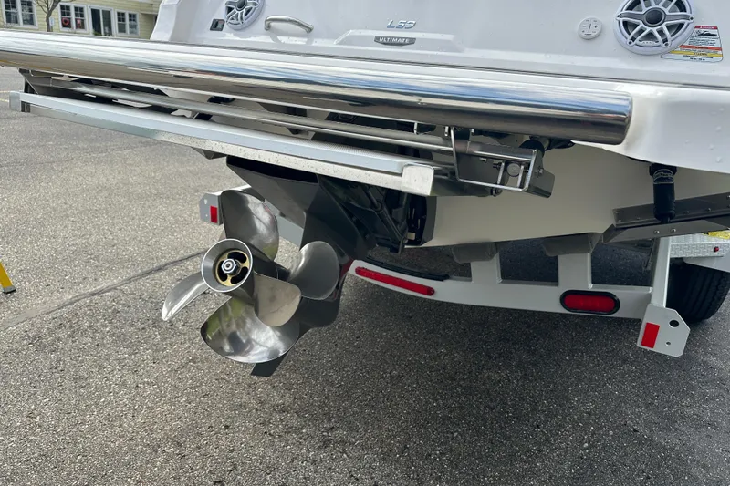 Slide: The Image of 2026 Regal LS9 boat stern with propeller and speakers on a trailer. - 5