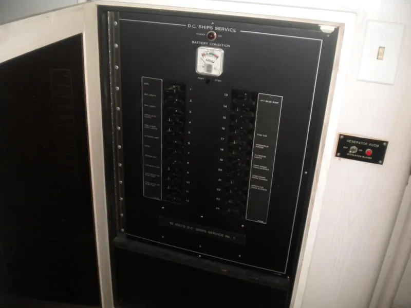 Slide: The Image of Electrical panel on a 1987 Hatteras 53 Motor Yacht, showing battery condition meter. - 16