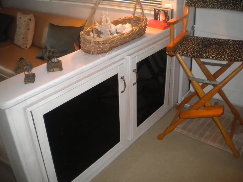 Slide: The Image of Interior of 1987 Hatteras 53 Motor Yacht with cabinet and leopard-print chair. - 18