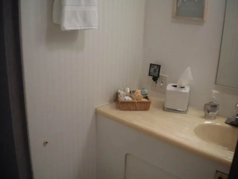 Slide: The Image of Bathroom interior of 1987 Hatteras 53 Motor Yacht with sink and toiletries. - 21