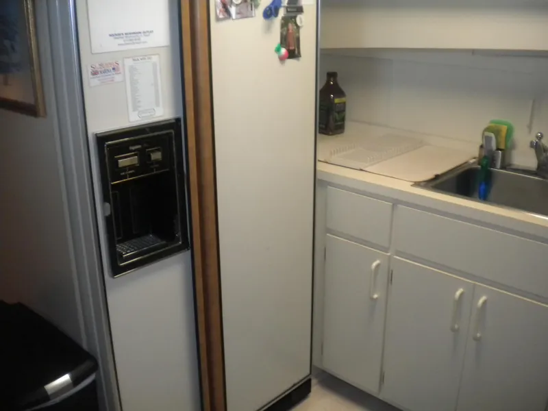 Slide: The Image of Kitchen area of 1987 Hatteras 53 Motor Yacht with fridge and sink. - 23