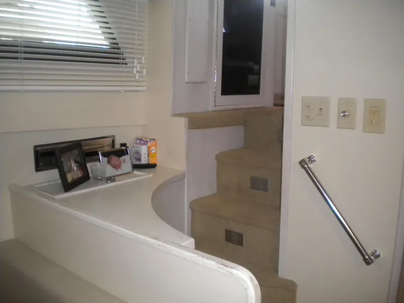 Slide: The Image of Interior of 1987 Hatteras 53 Motor Yacht with stairs and decor elements. - 25