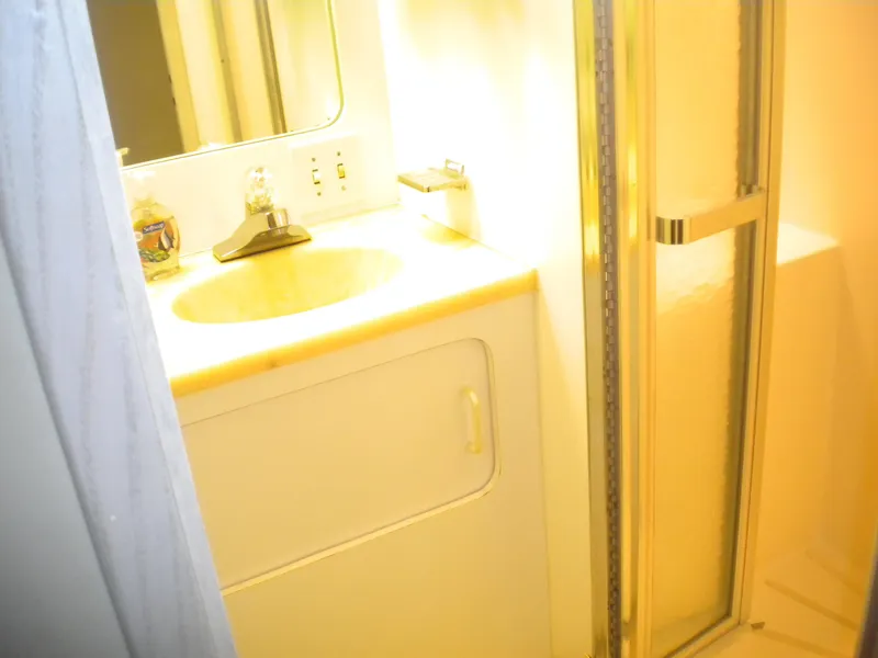 Slide: The Image of Bathroom interior of 1987 Hatteras 53 Motor Yacht with sink and shower. - 29