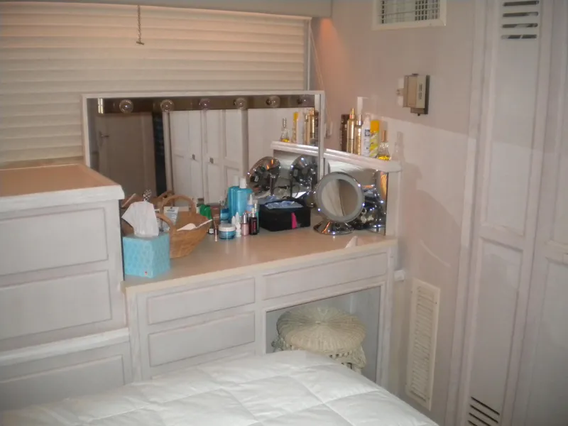 Slide: The Image of Interior of 1987 Hatteras 53 Motor Yacht with vanity and storage. - 34