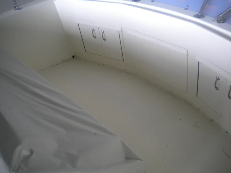 Slide: The Image of 1987 Hatteras 53 Motor Yacht interior with storage compartments and seating area. - 36